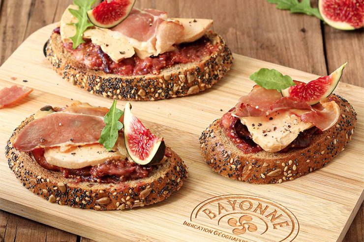 bayonne ham slices on toast with foie gras