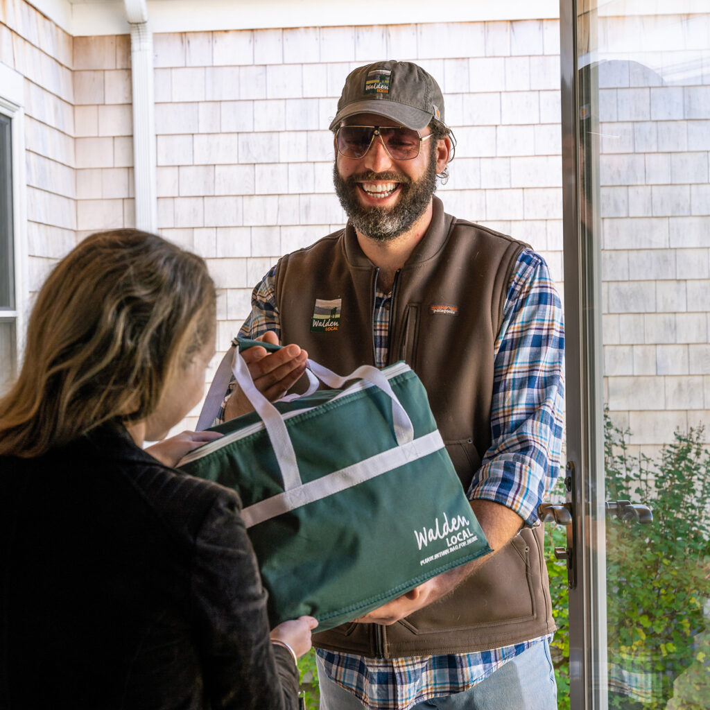 Walden Local deliveryman dropping off meat