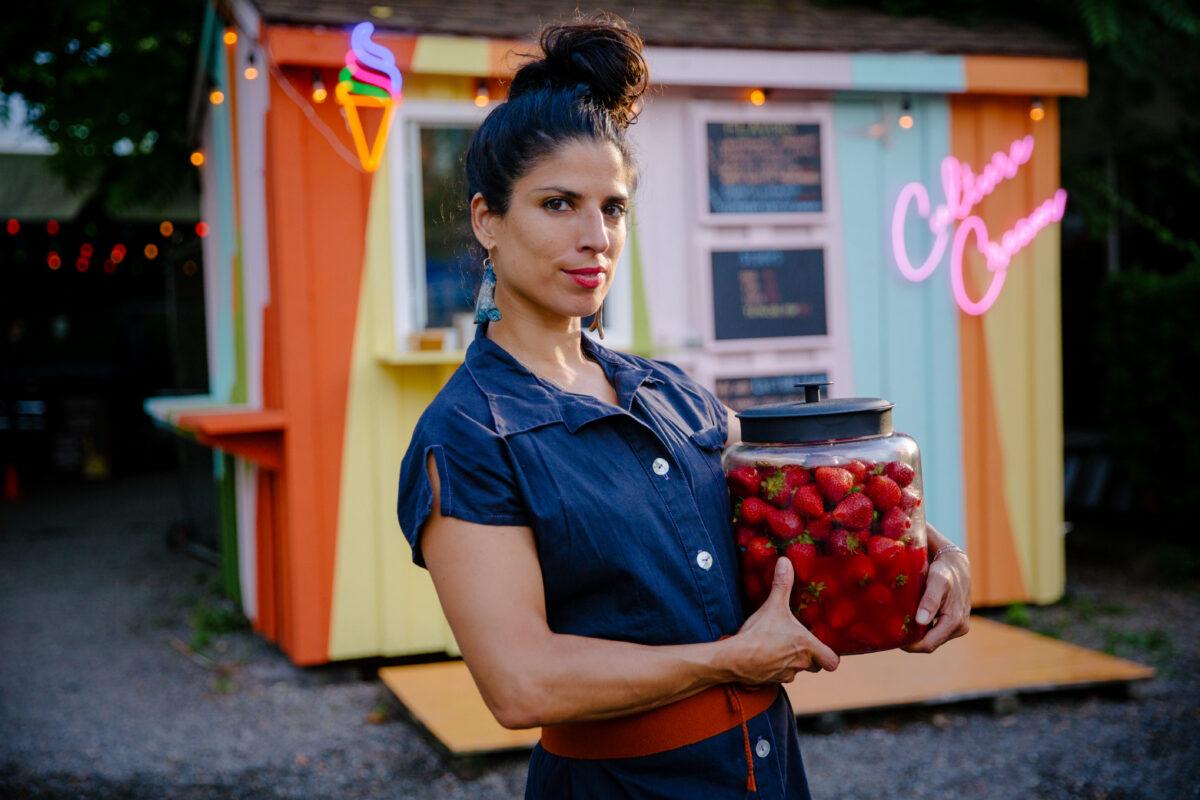 woman holding strawberries