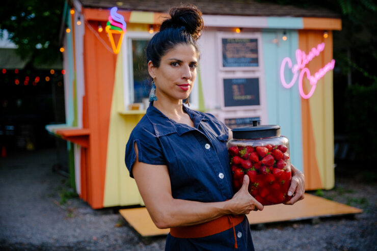 woman holding strawberries