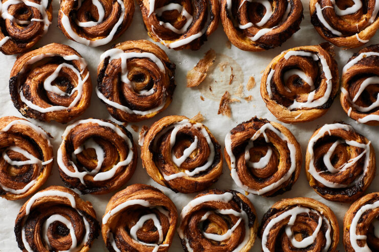 danish pastries lined up on parchment