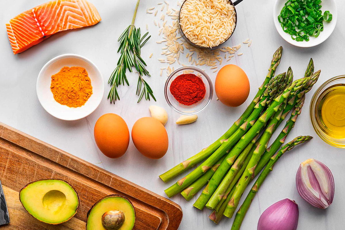 brightly colored fresh food ingredients scattered across a countertop