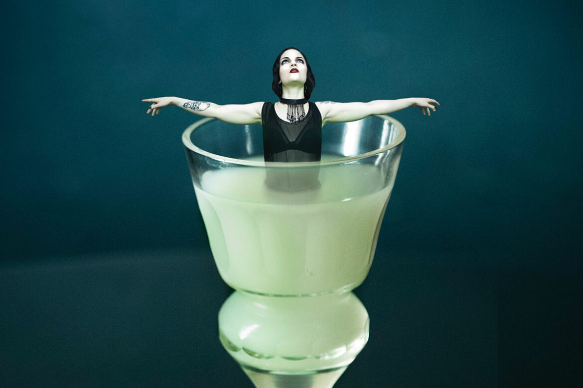 woman bathing in absinthe glass