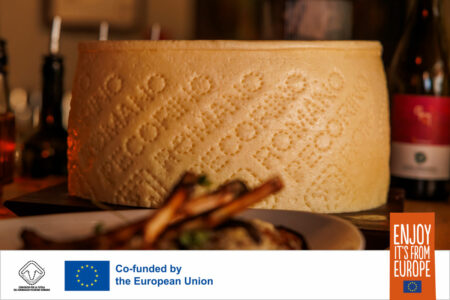 a wheel of pecorino romano pdo cheese on a restaurant dinner table