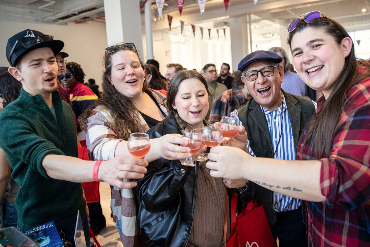 a group of people enjoying a cider festival