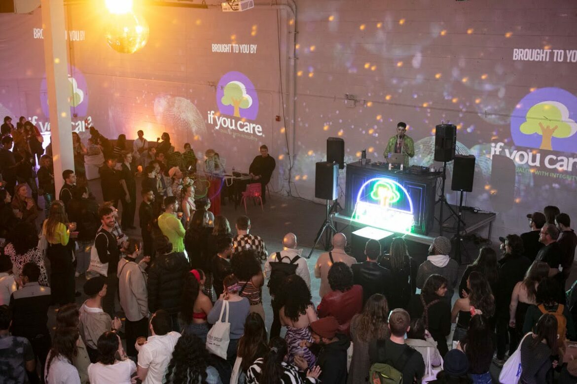 a crowd gathers at a disco themed party